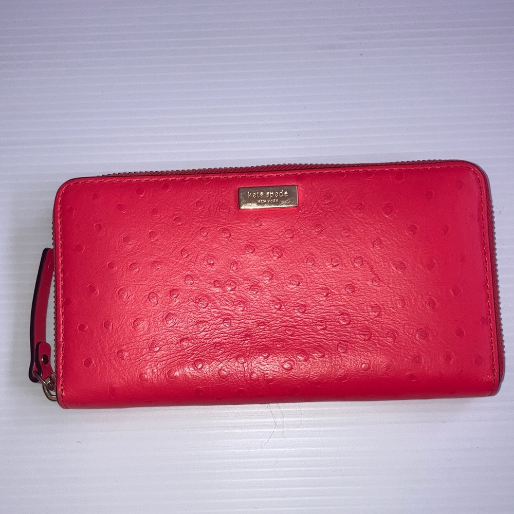 Kate Spade coral leather zip up clutch wallet.